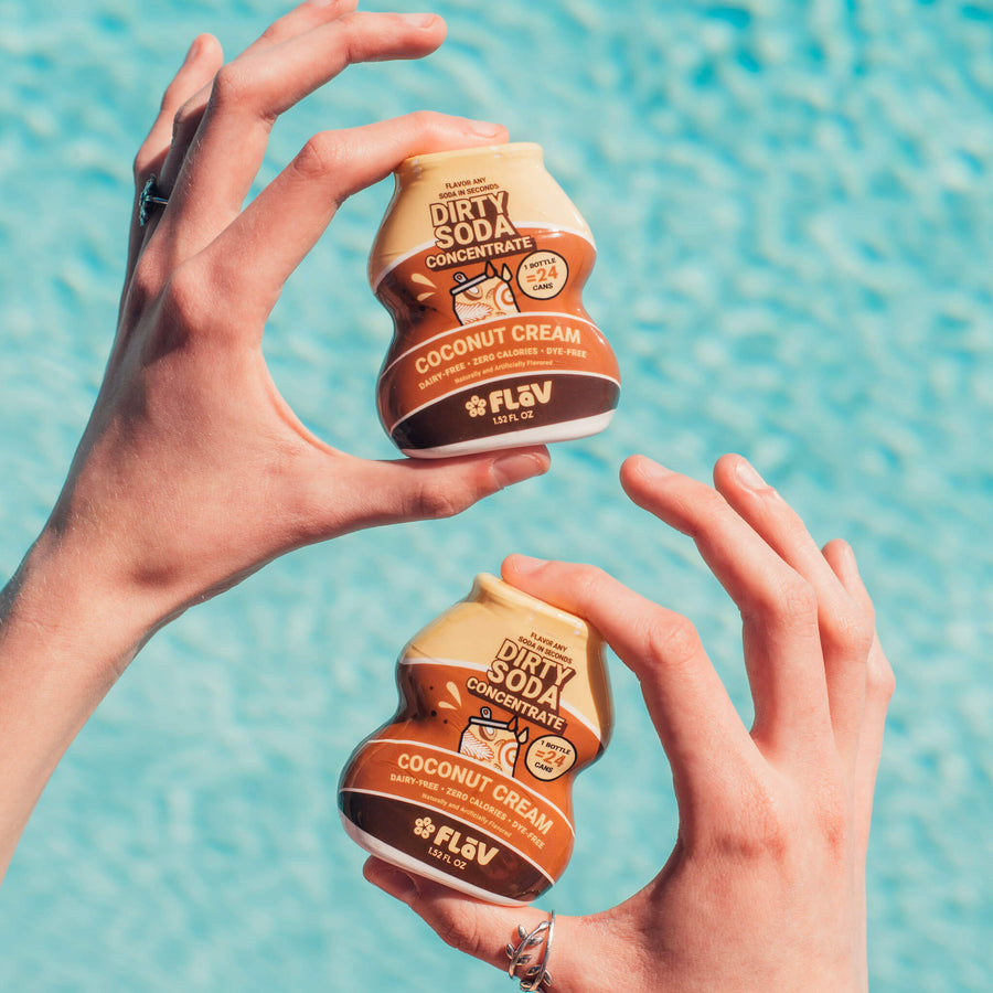 Coconut Cream Flav bottles held poolside