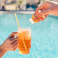 Flav concentrate being squeezed into a dirty soda
